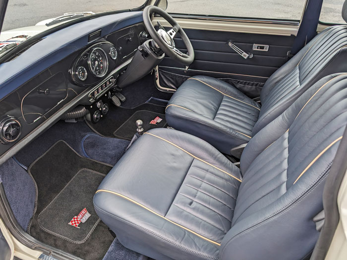 Luxury Interior of 'Merlin' The EV Mini, complete with 8-speaker Bluetooth sound system.